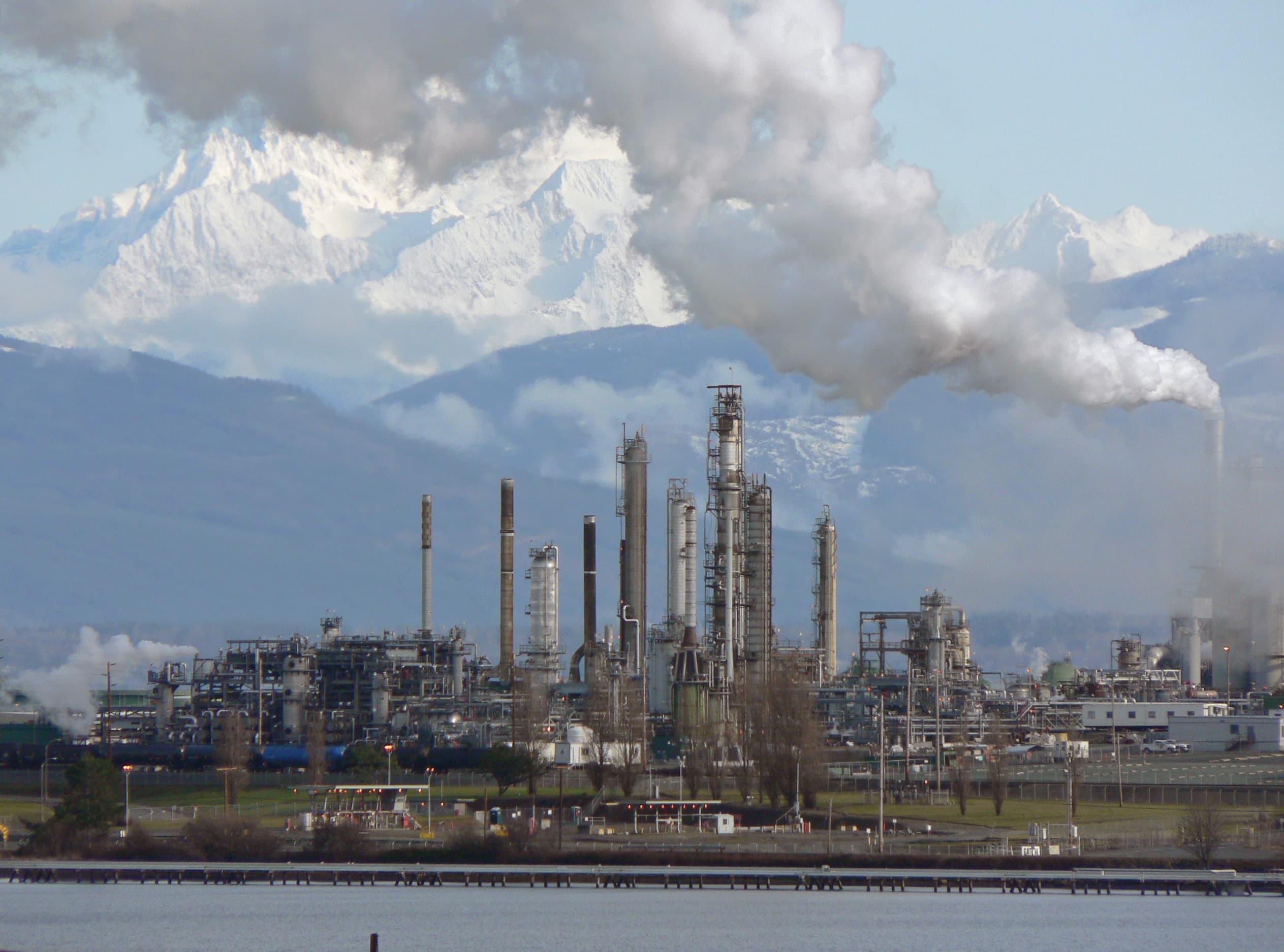 Oil refinery with distillation towers at dusk